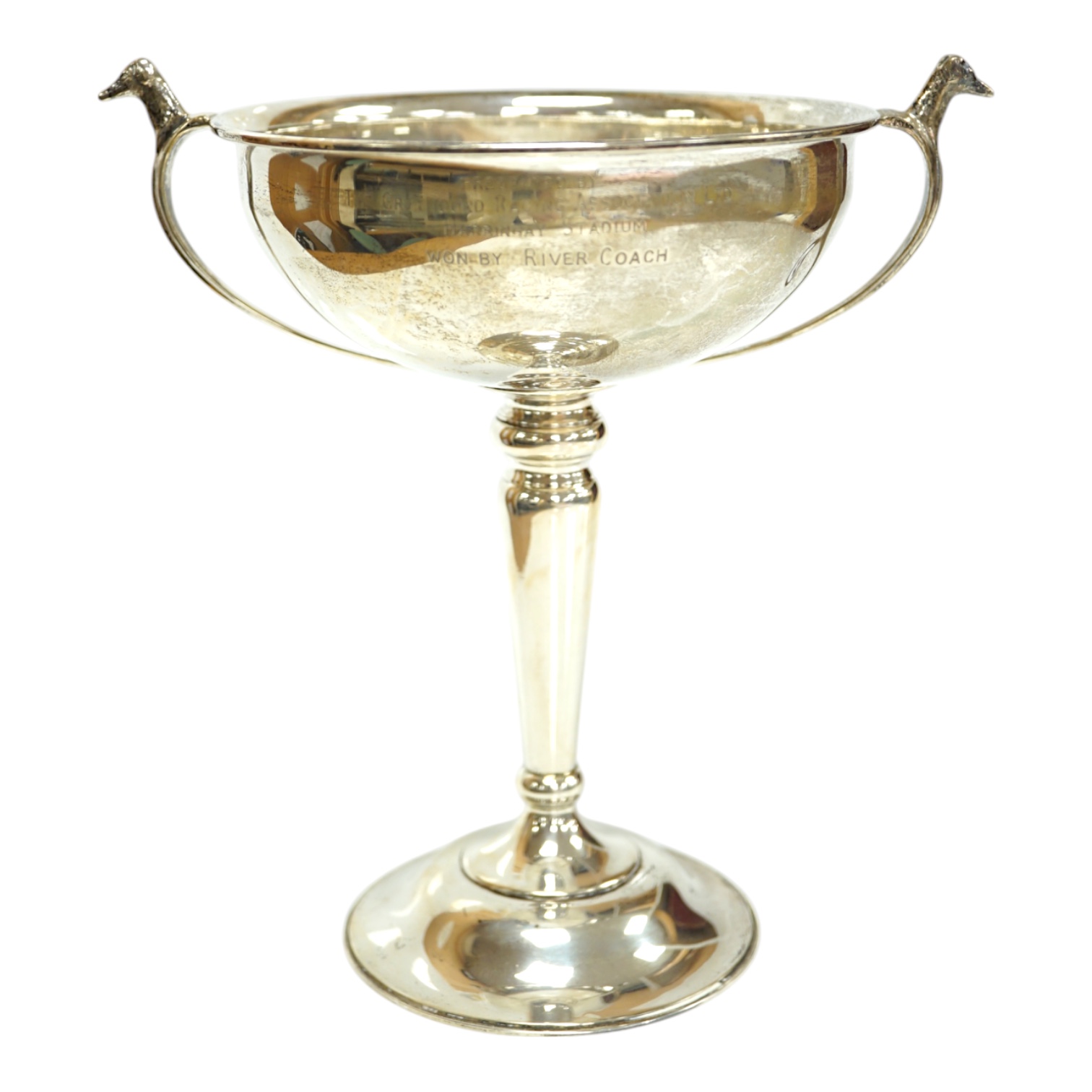 A 1930's silver two handled presentation greyhound trophy cup, with greyhound head handle terminals and engraved inscription, Carrington & Co, London, 1937, 18.7cm, 7.5oz. Condition - poor